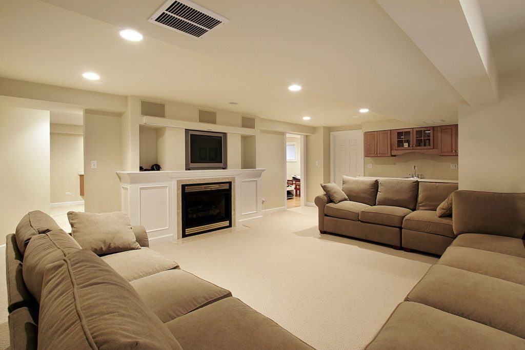Classic white walled living space with furnace and coffee sofa set