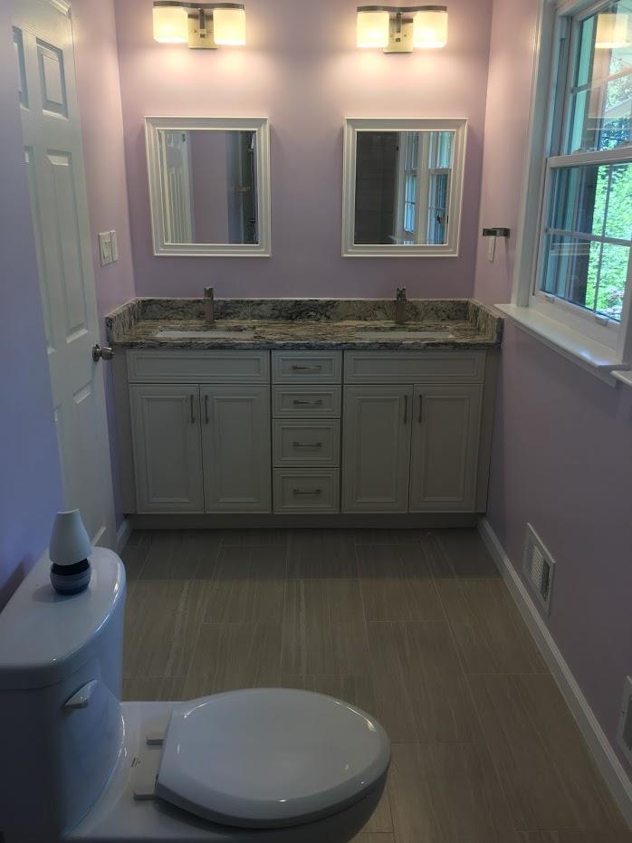 Pastel colored powder room with toilet