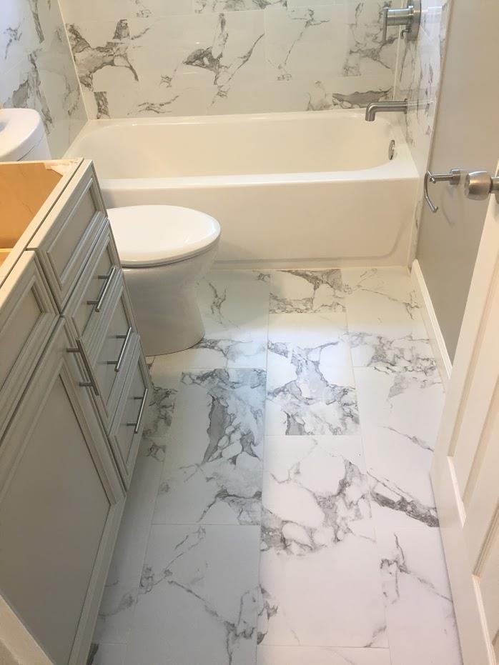 small space bathroom area with toilet and cabinets
