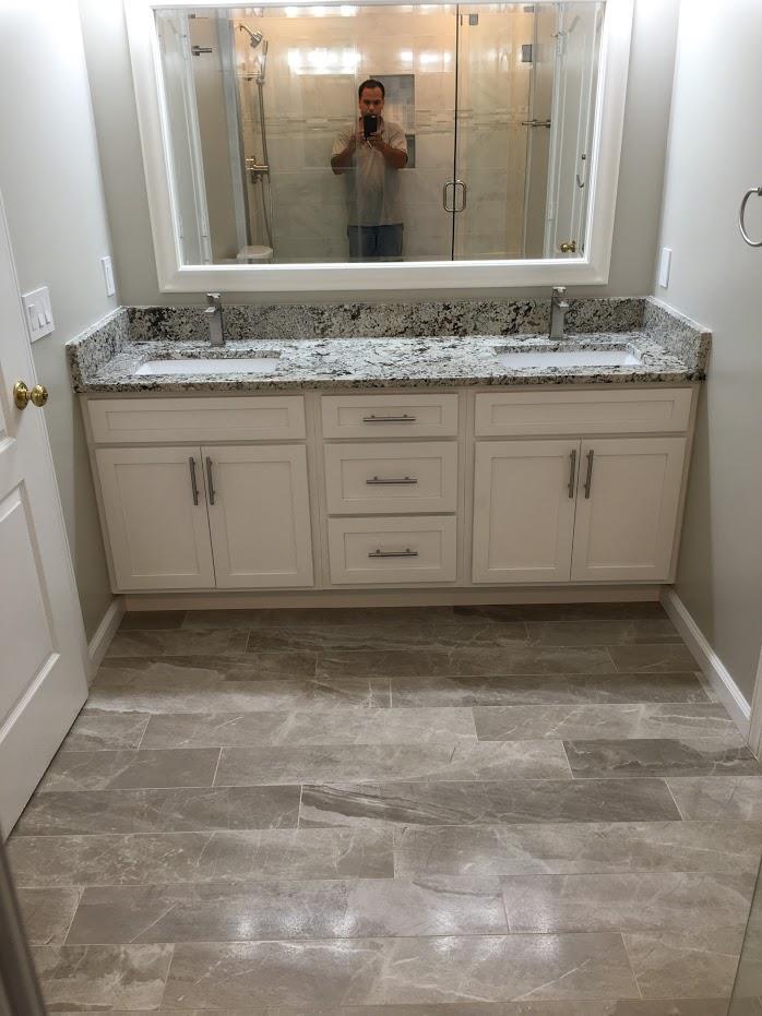Complete bathroom remodeling with cabinets and flooring