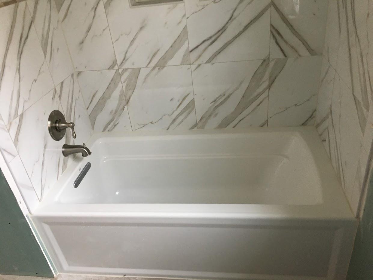 small space bath tub with faucet and shower