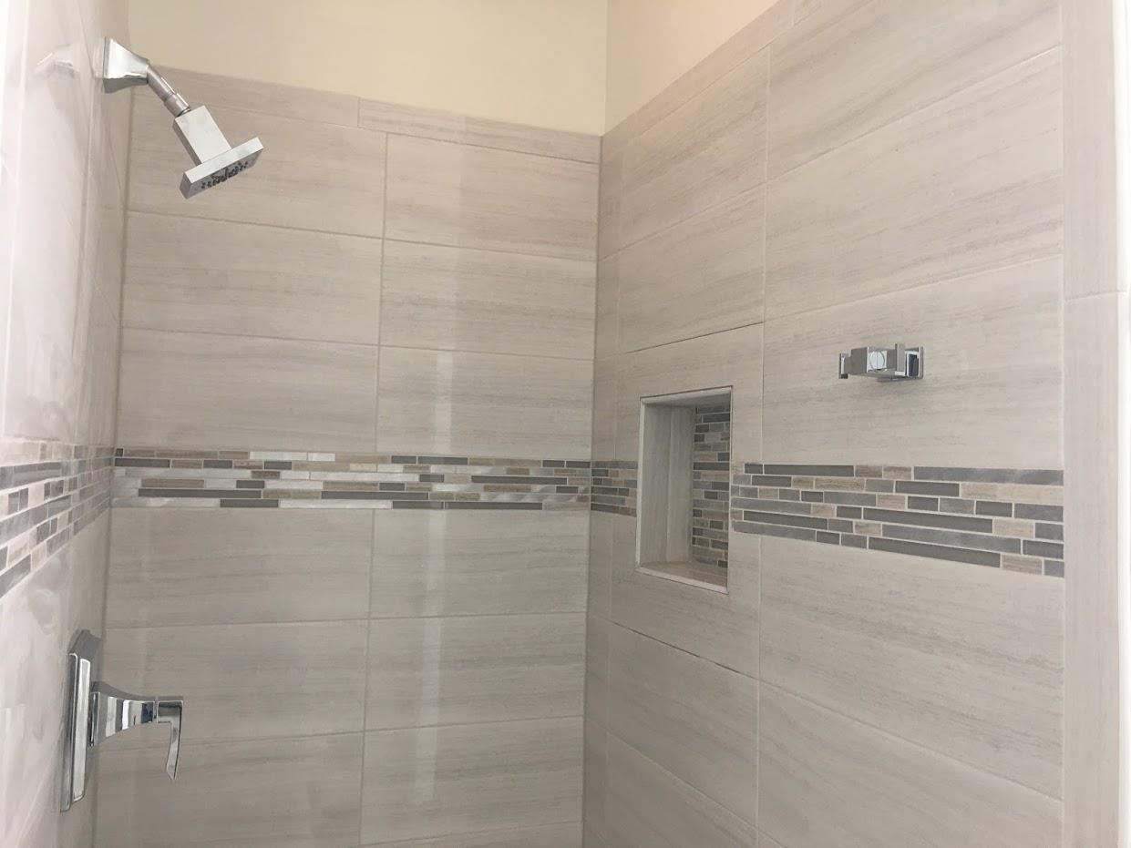 Complete shower room setup with tiles