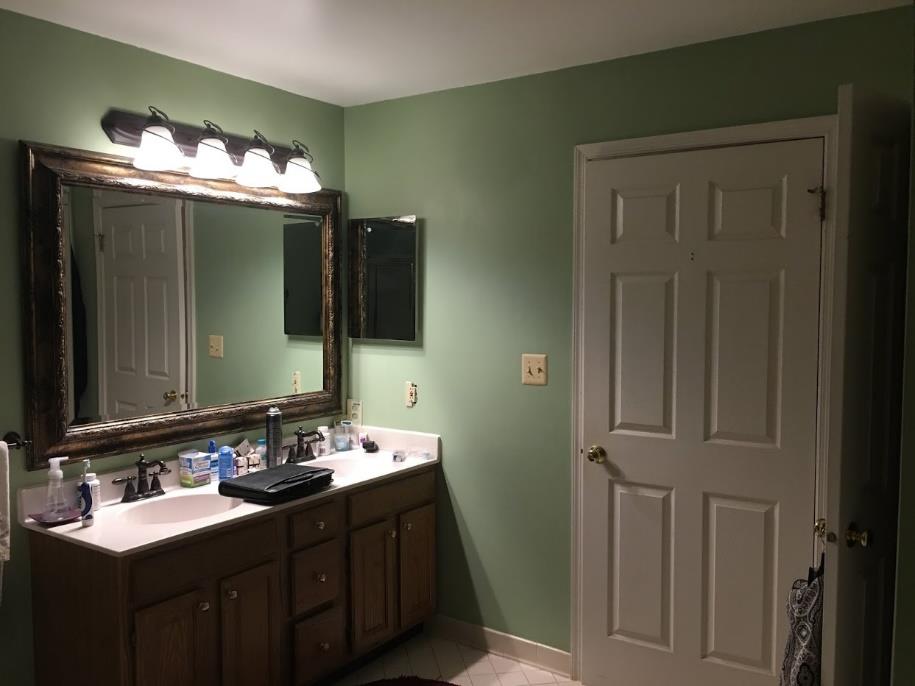 A powder room setup before the remodeling project