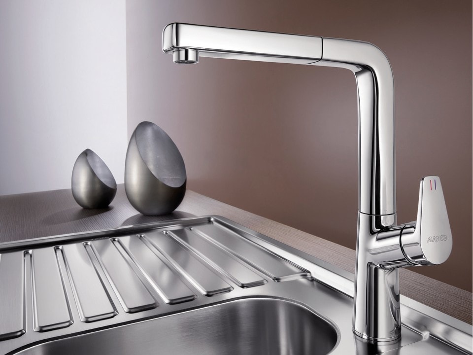 Blanco Faucets on metallic sink table top and kitchen design