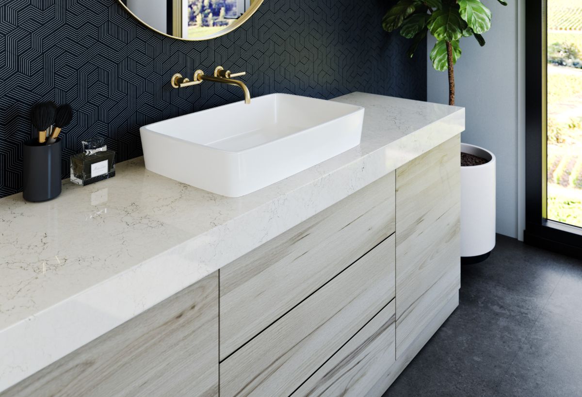 Cambria Countertop Stone single sink with wooden drawers and patterned wall