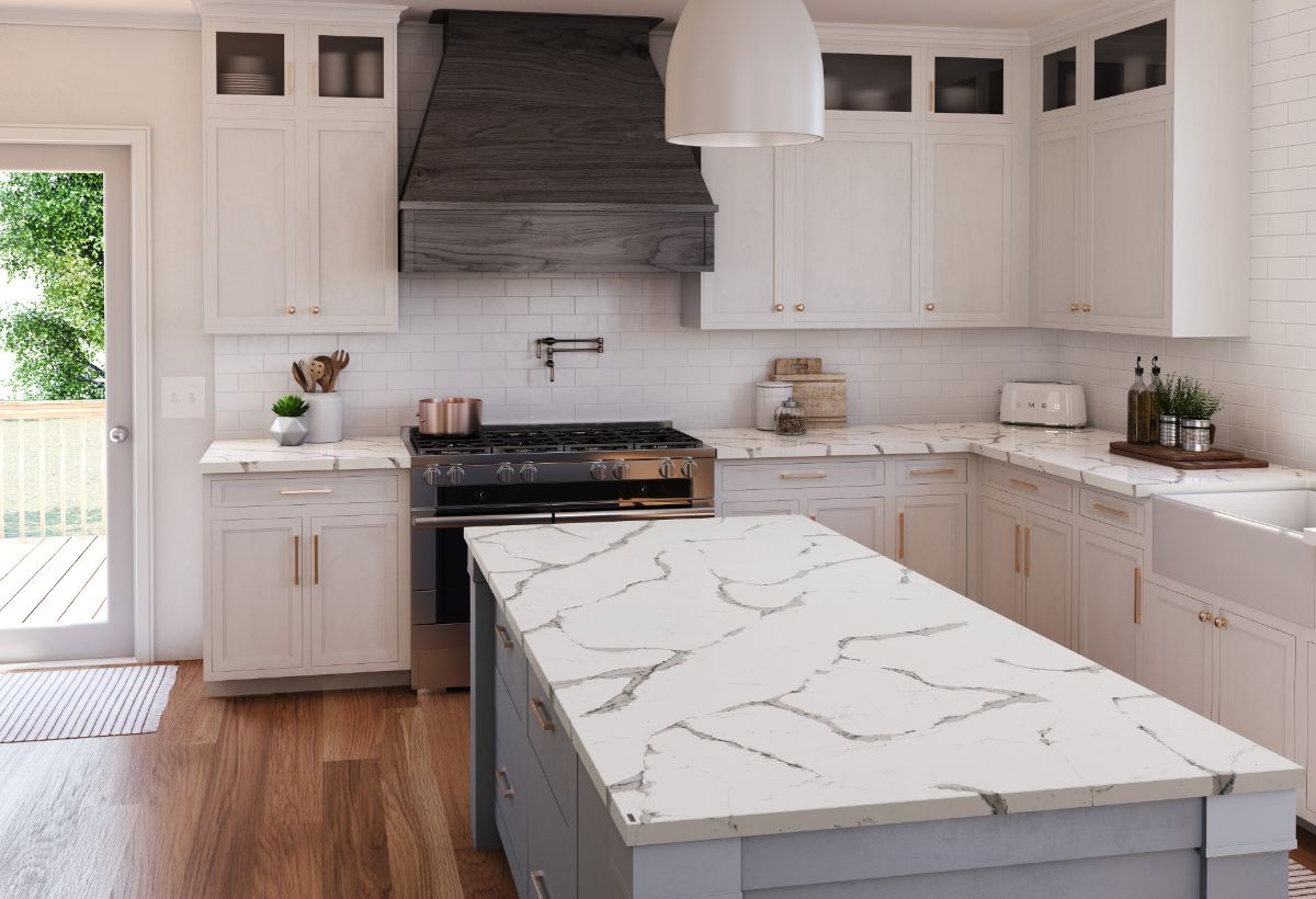 Cambria Countertop Stone with white cabinets and rustic oven