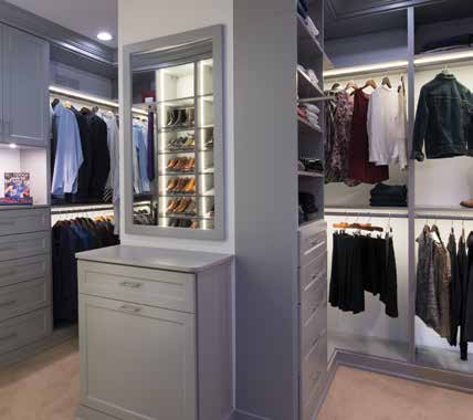 Custom closet with drawers and mirror