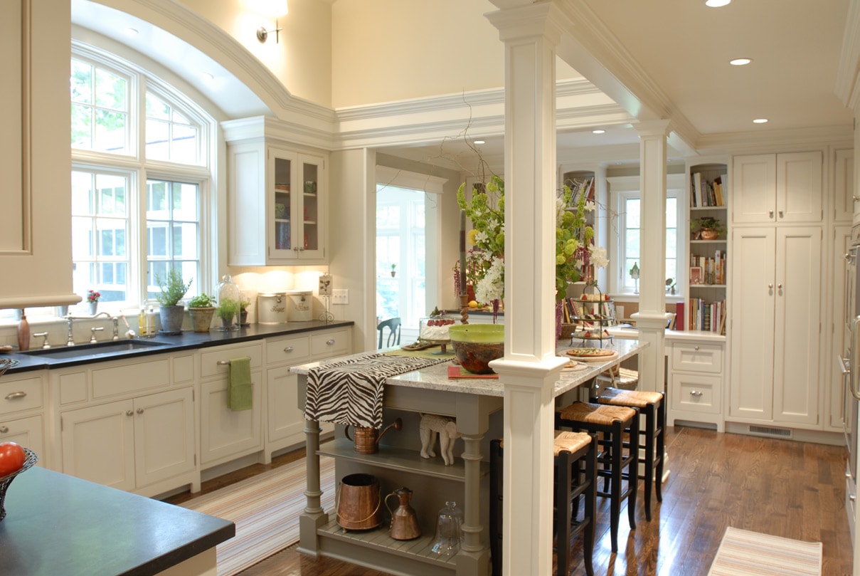 All white Craft-Maid Cabinets in a classic kitchen setup with columns
