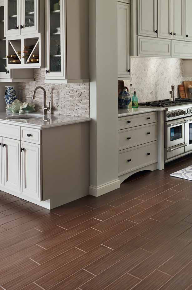 MSI Mosaic tiles in kitchen walls with white cabinet and hardwood flooring