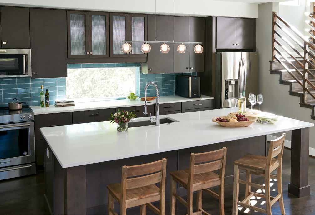 Marsh wooden kitchen cabinets with stone counter top and lighting fixture