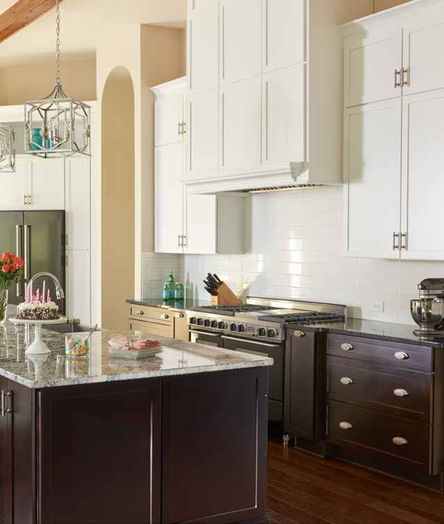 Marsh white and brown wooden cabinets with stone counter top