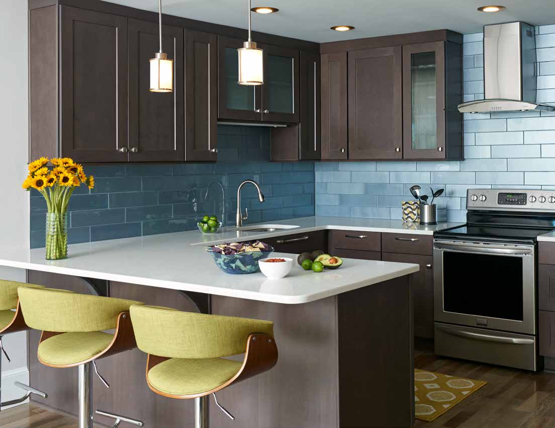 Marsh wooden kitchen cabinets with blue patterned walls