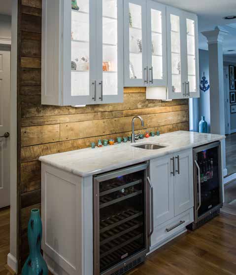 Marsh all white kitchen cabinets with wooden walls