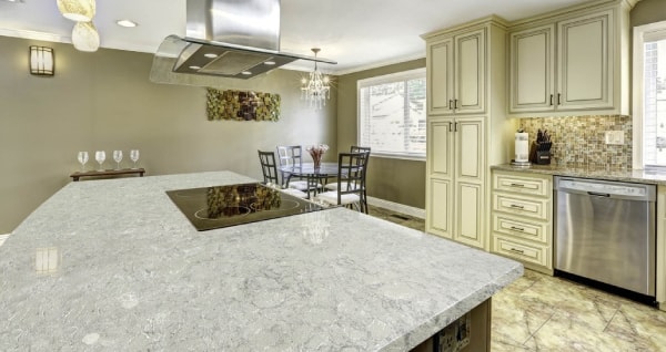 spectrum quartz stone kitchen countertop with cream cabinets